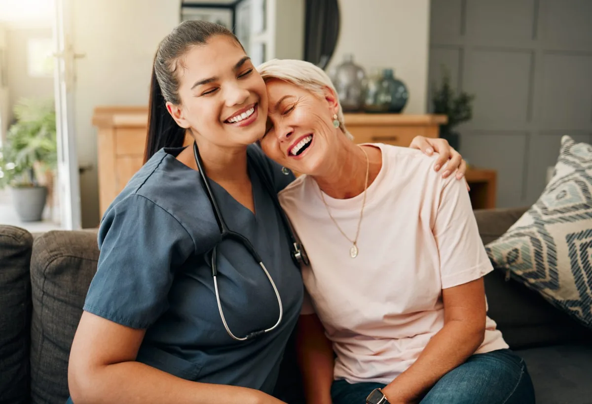 Caregiver sharing a warm moment with a senior client in Philadelphia